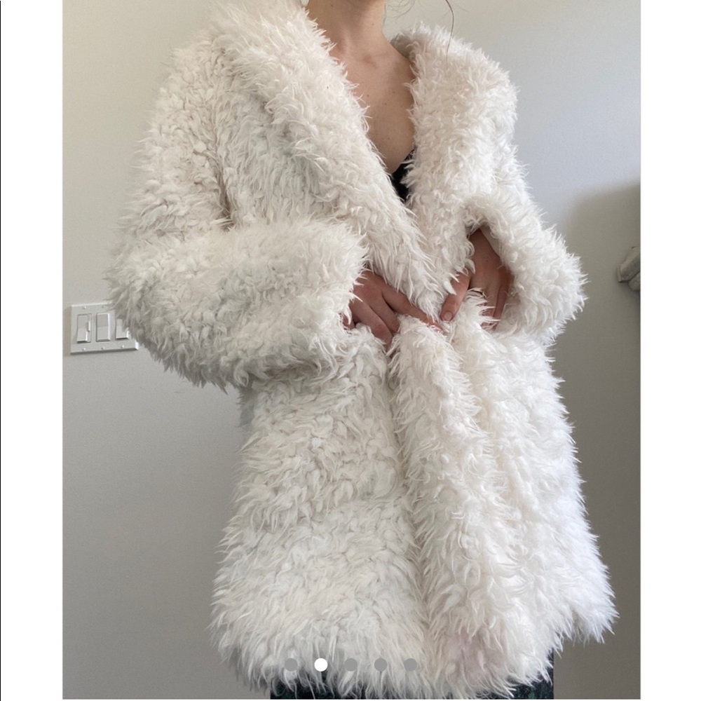 white fluffy jacket